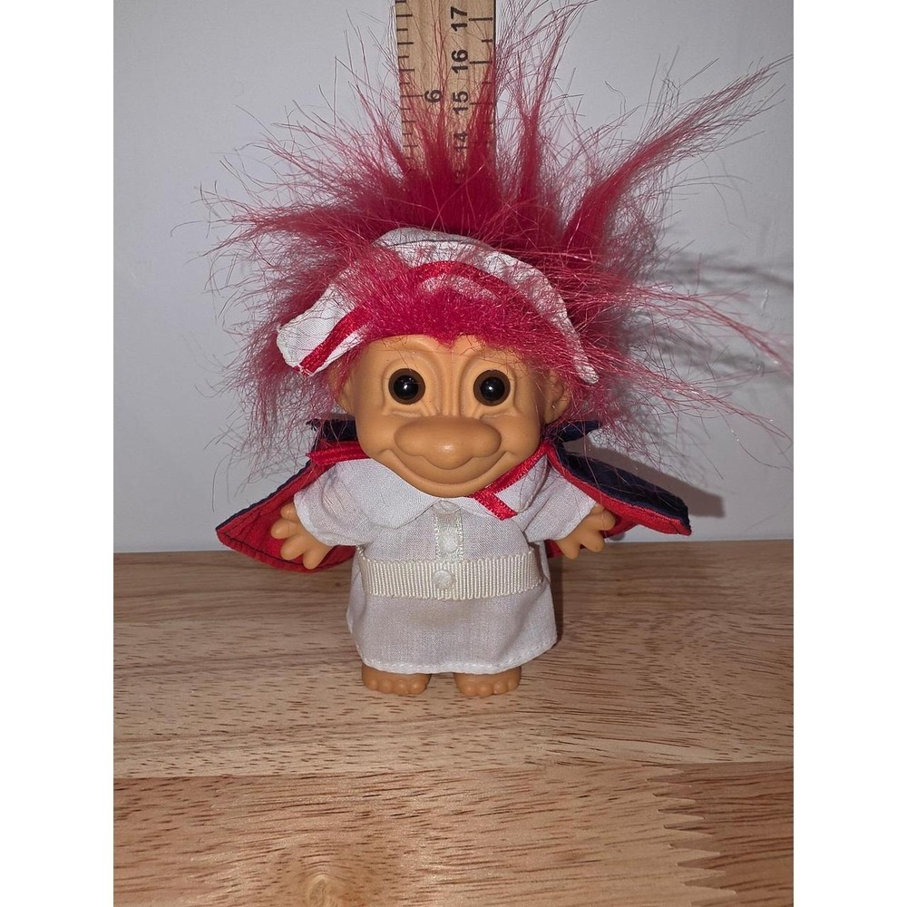 vintage Russ Berrie Florence Nightingale Nurse Troll Doll featuring bright red